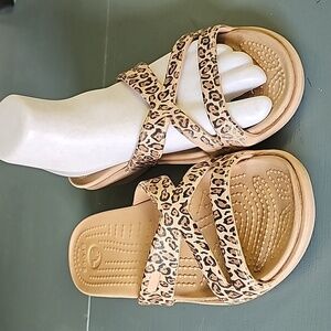 Crocks, ribber sandles with leopard design. Normal wear. Size  7